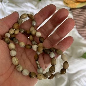 Necklace. Choker length. Browns and creams. Feels like a tropical vacation.